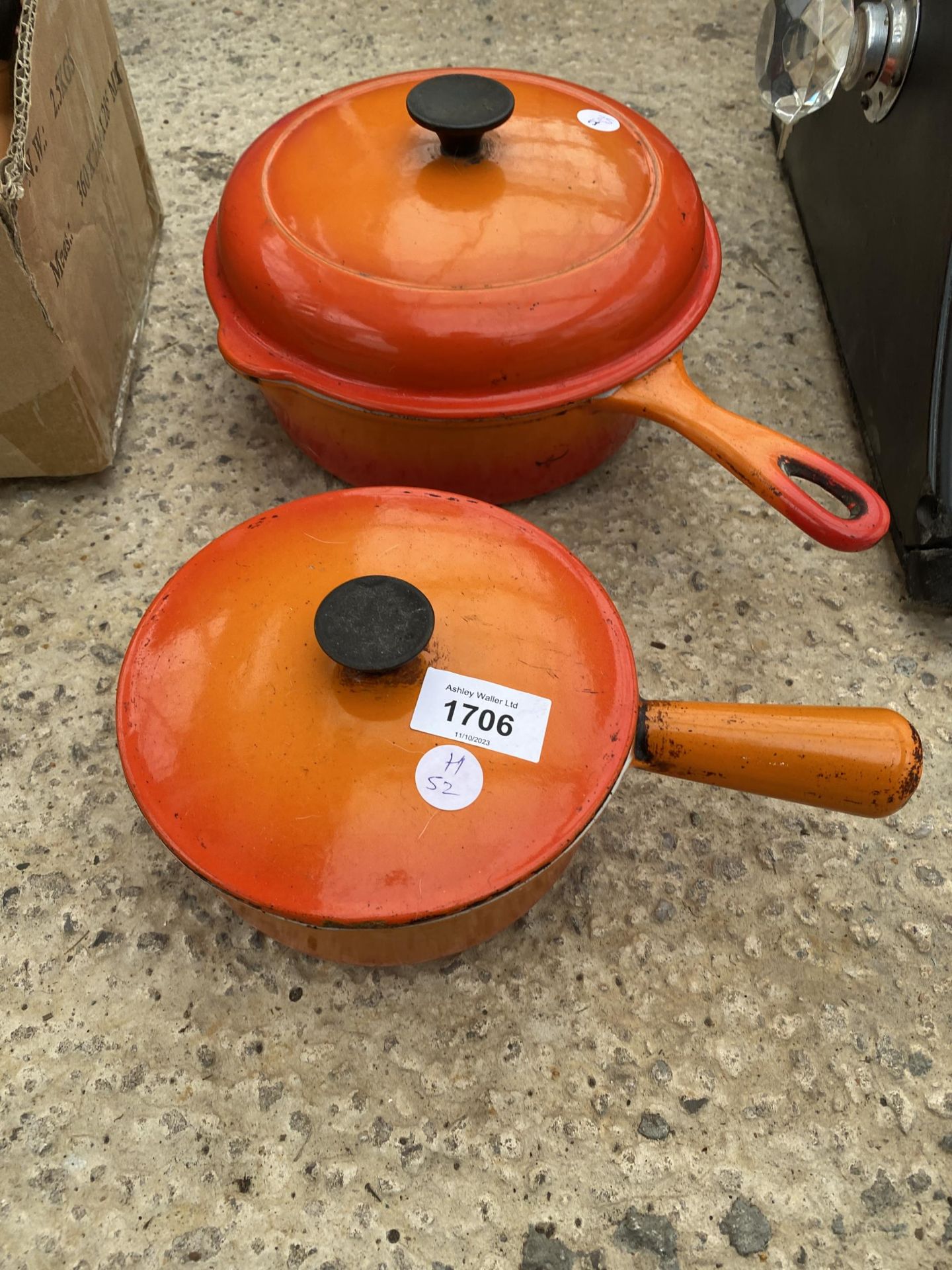 TWO VINTAGE ORANGE CAST IRON COOKING PANS, ONE LABELED LE CREUSET
