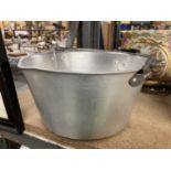 A LARGE STAINLESS STEEL JAM PAN