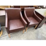 A PAIR OF BROWN FAUX LEATHER FIRESIDE CHAIRS