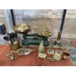 AN ASSORTMENT OF BRASS ITEMS TO INCLUDE SCALES AND WEIGHTS, TRIVET STANDS AND CANDLE STICKS ETC