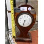 A DECORATIVE MAHOGANY MANTLE CLOCK