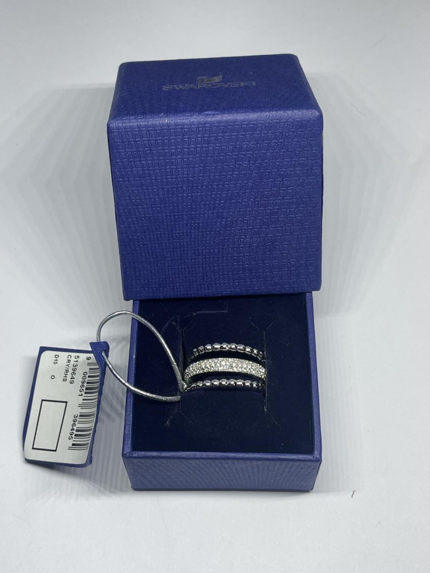 A SWAROVSKI CRYSTAL RING WITH LABEL IN A PRESENTATION BOX WITH SLEEVE SIZE Q/R - Image 2 of 2