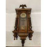 A MAHOGANY CASED VIENNA WALL CLOCK WITH EAGLE DESIGN TOP, WITH PENDULUM AND KEY