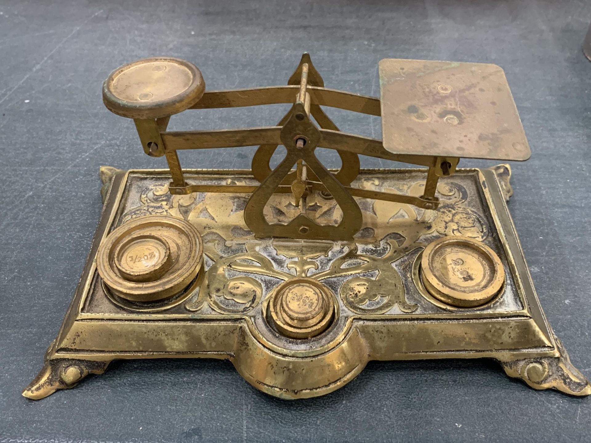 A SET OF BRASS SCALES WITH WEIGHTS