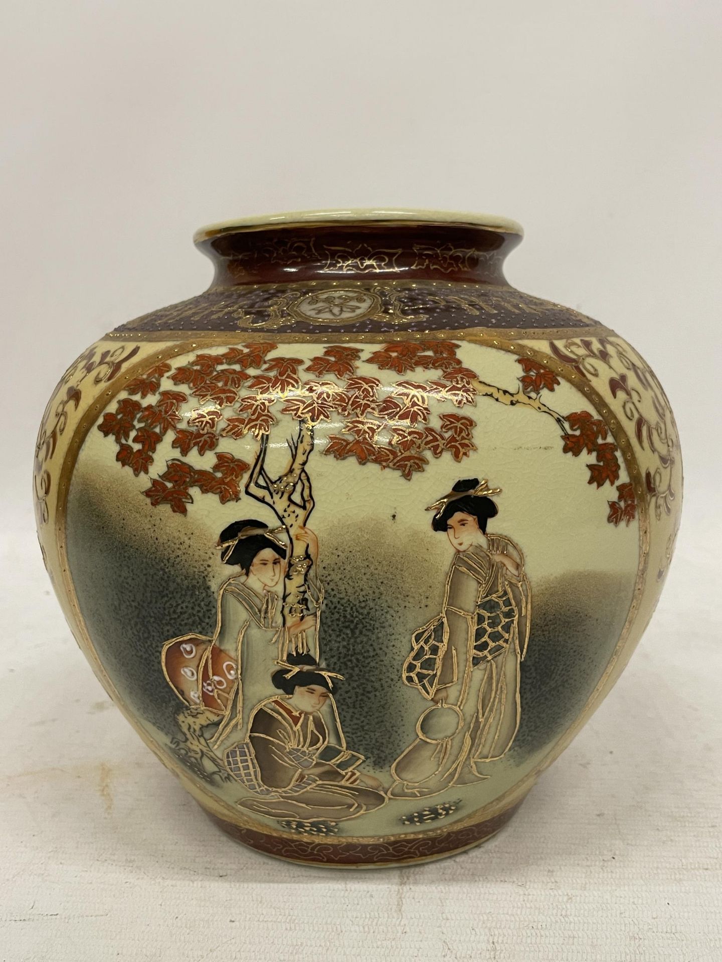 A VINTAGE JAPANESE SATSUMA POTTERY VASE WITH FIGURAL DESIGN