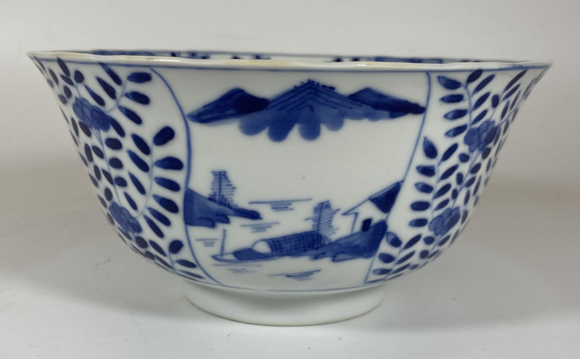A 19TH CENTURY CHINESE KANGXI REVIVAL BLUE AND WHITE PORCELAIN BOWL, FOUR CHARACTER, DOUBLE RING