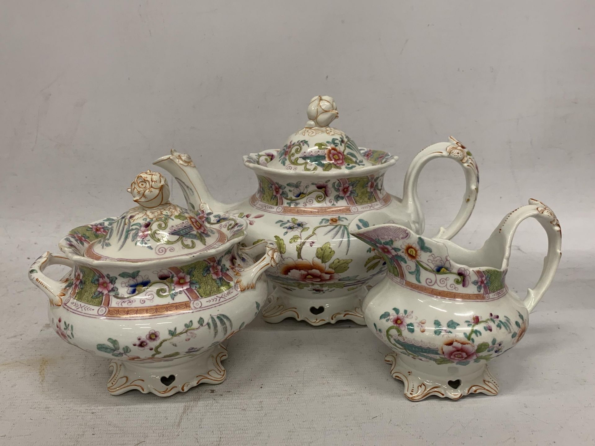 A 19TH CENTURY THREE PIECE TEA SET WITH ORIENTAL STYLE PATTERNED DESIGN