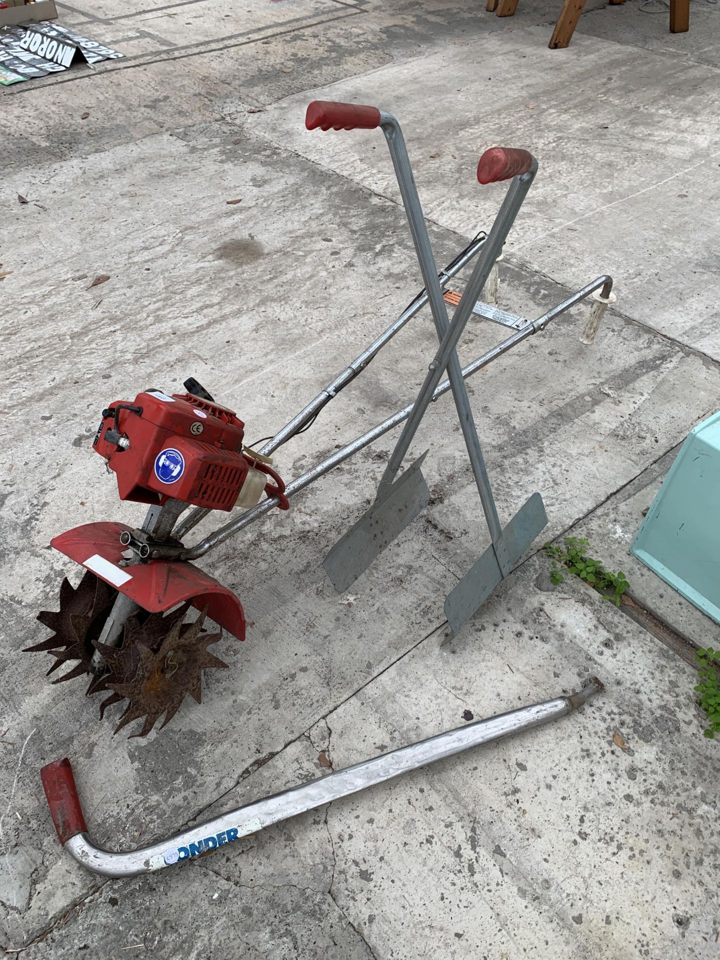 A MANCIS PETROL GARDEN ROTAVATOR, A LEAF SCOOP AND A MANHOLE KEY