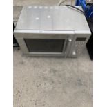 A SILVER SAINSBURYS MICROWAVE OVEN BELIEVED IN WORKING ORDER BUT NO WARRANTY