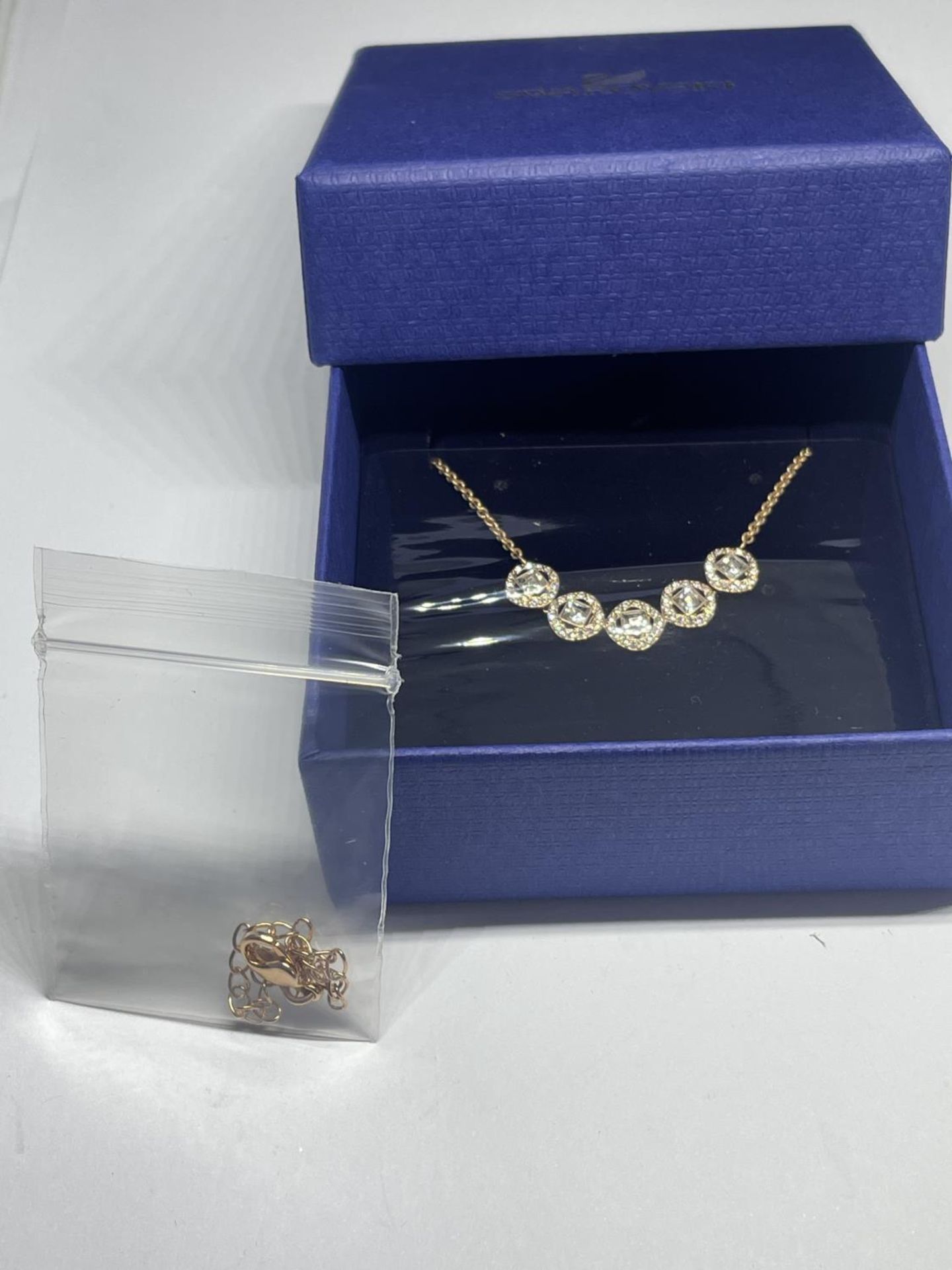 A SWAROVSKI CRYSTAL NECKLACE WITH PRESENTATION BOX AND SLEEVE