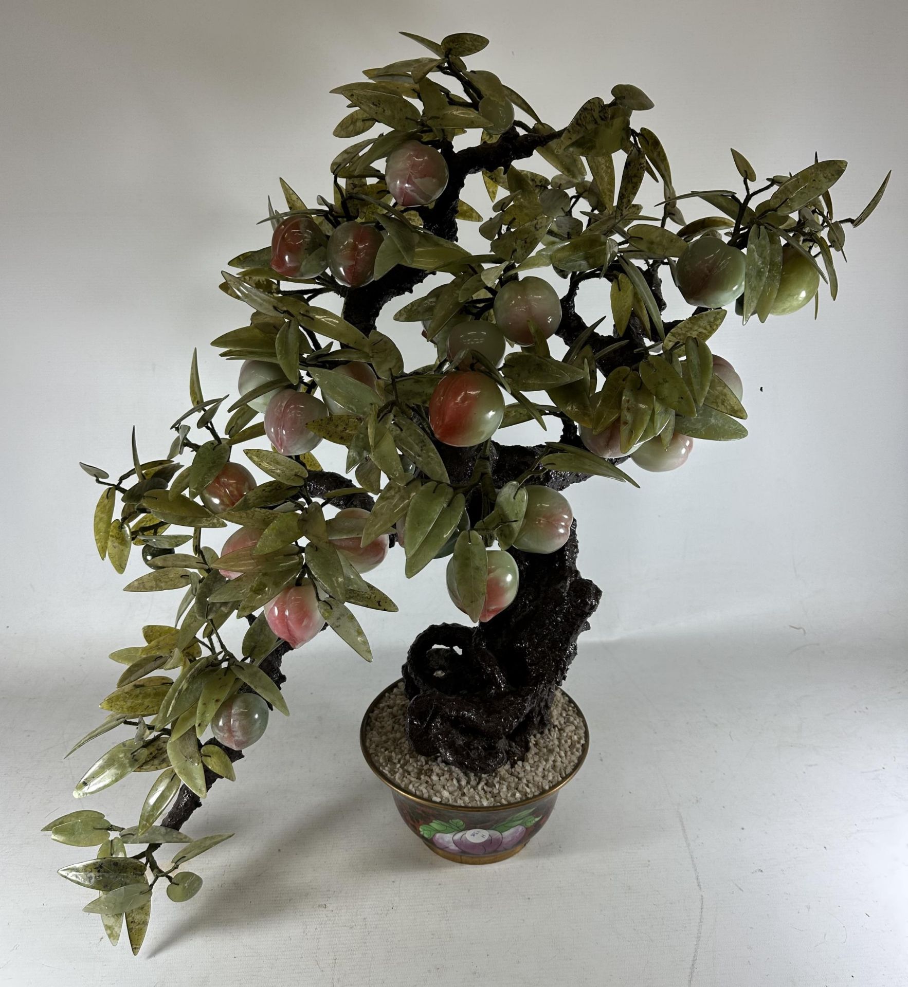 A LARGE AND IMPRESSIVE ORIENTAL MODEL OF A BONSAI TREE WITH GREEN GLASS LEAVES AND PINK FRUIT