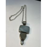 A SILVER NECKLACE WITH LARGE STONE PENDANT
