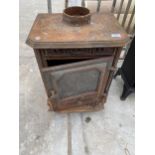 A VINTAGE CAST IRON LOG BURNER