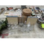 A LARGE ASSORTMENT OF ITEMS TO INCLUDE CHARGER PLATES, CUT BRANDY GLASSES AND CUT GLASS DECANTORS TO