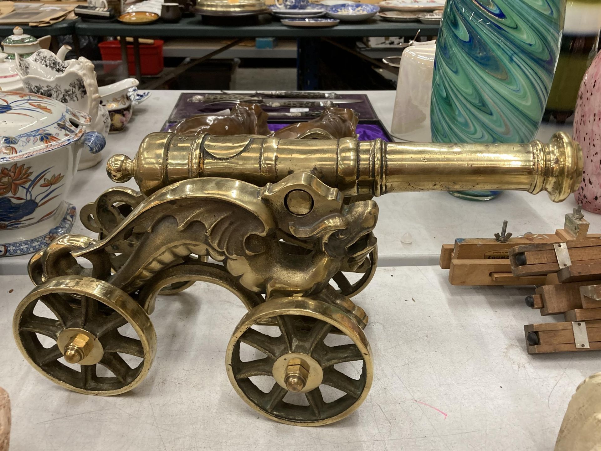 A VINTAGE BRASS MODEL OF A CANNON