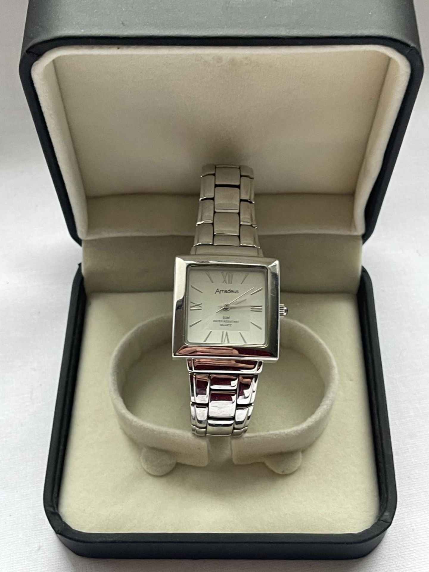 A SQUARE FACED AMADEUS AUTOMATIC WRIST WATCH IN A PRESENTATION BOX SEEN WORKING BUT NO WARRANTY