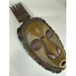 A LARGE VINTAGE AFRICAN TRIBAL WOODEN MASK WITH PAINTED DESIGN, LENGTH 65CM