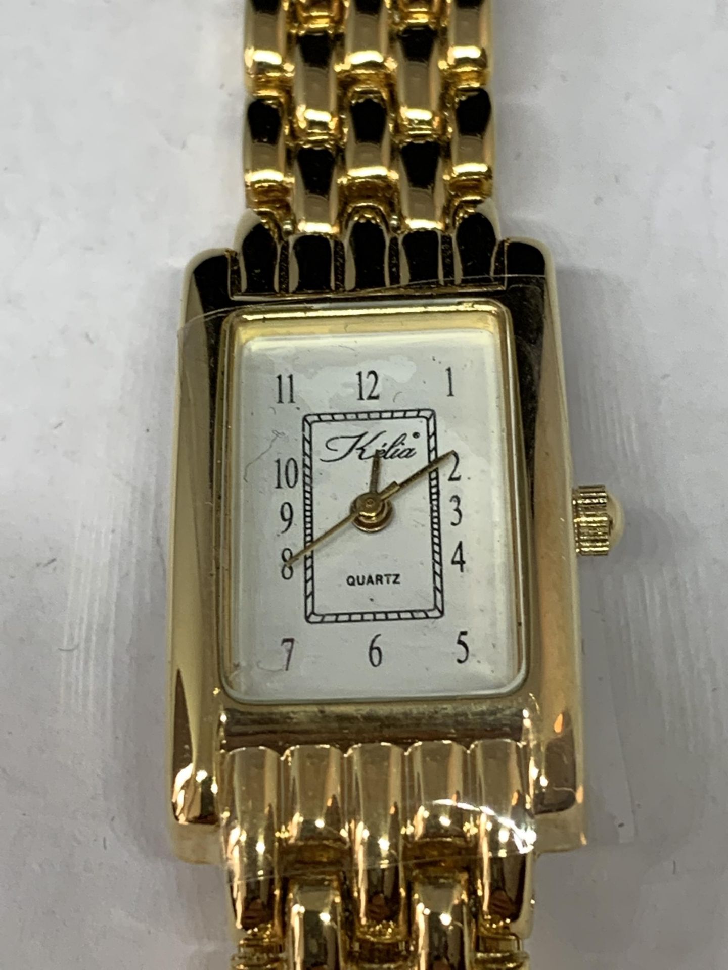 A YELLOW METAL WRIST WATCH WITH RECTANGULAR FACE SEEN WORKING BUT NO WARRANTY - Image 2 of 3
