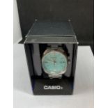 A CASIO CALENDAR WRIST WATCH IN A PRESENTATION BOX SEEN WORKING BUT NO WARRANTY