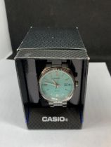 A CASIO CALENDAR WRIST WATCH IN A PRESENTATION BOX SEEN WORKING BUT NO WARRANTY