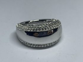 A SWAROVSKI CRYSTAL RING WITH LABEL IN A PRESENTATION BOX WITH SLEEVE SIZE R