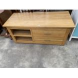 A MODERN OAK TV STAND ENCLOSING TWO DRAWERS, 55" WIDE