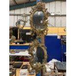 A PAIR OF VINTAGE GILT GESSO ORNATE MIRROR WITH TWIN BRANCH CANDLE HOLDERS