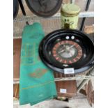 A VINTAGE ROULETTE GAME CONSISTING OF A WHEEL, COUNTERS AND CLOTH ETC