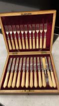 A CASED TWENTY FOUR PIECE CUTLERY SET WITH HALLMARKED SHEFFIELD SILVER COLLARS, MAKER J.S