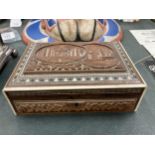 A WOODEN BOX WITH CARVING AND INLAY TO THE LID