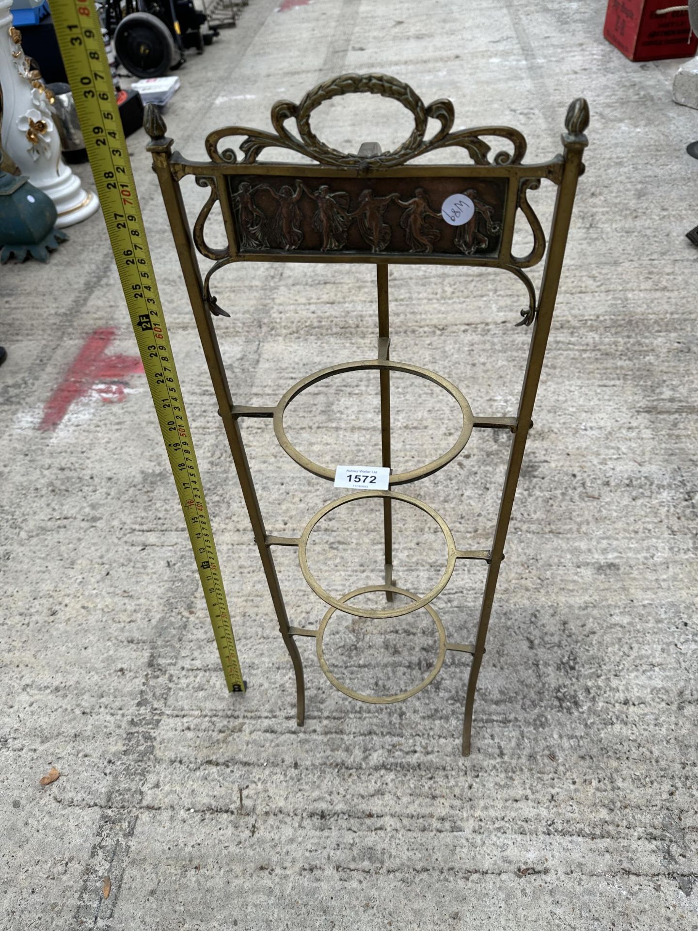 A VINTAGE BRASS THREE TIER PLANT STAND