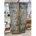 A METAL TWO DOOR STORAGE CUPBOARD