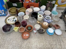 AN ASSORTMENT OF CERAMIC PLANT POTS AND CANDLE HOLDERS ETC