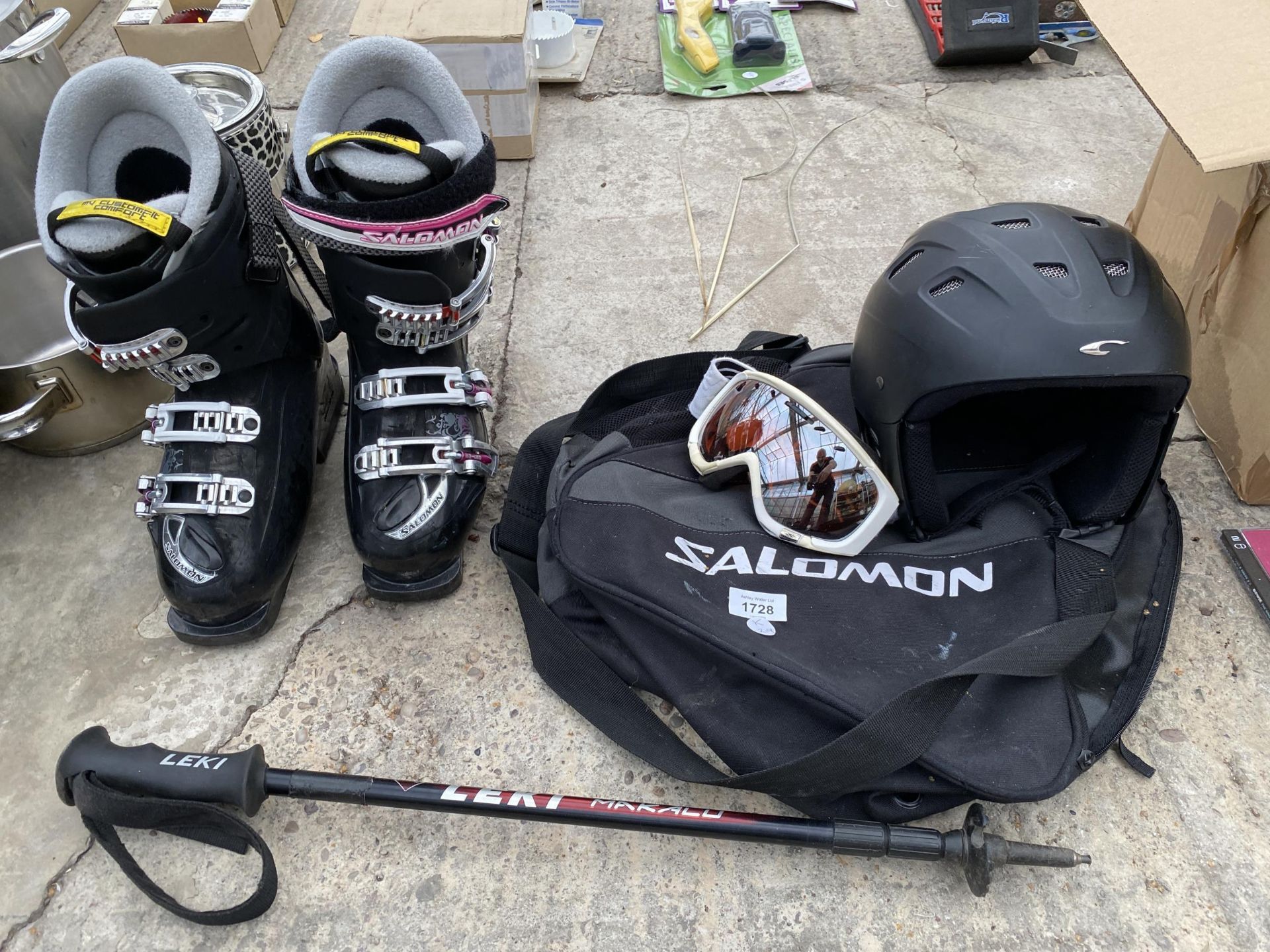 AN ASSORTMENT OF SKI EQUIPMENT TO INCLUDE BOOTS, GOGGLES AND A HELMET ETC