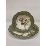 A PARAGON FOOTED TEACUP AND SAUCER GREEN WITH GOLD GILT AND FLORAL SPRAYS