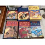SEVEN J K ROWLING HARRY POTTER BOOKS TO INCLUDE THREE HARD BACKED FIRST EDITIONS