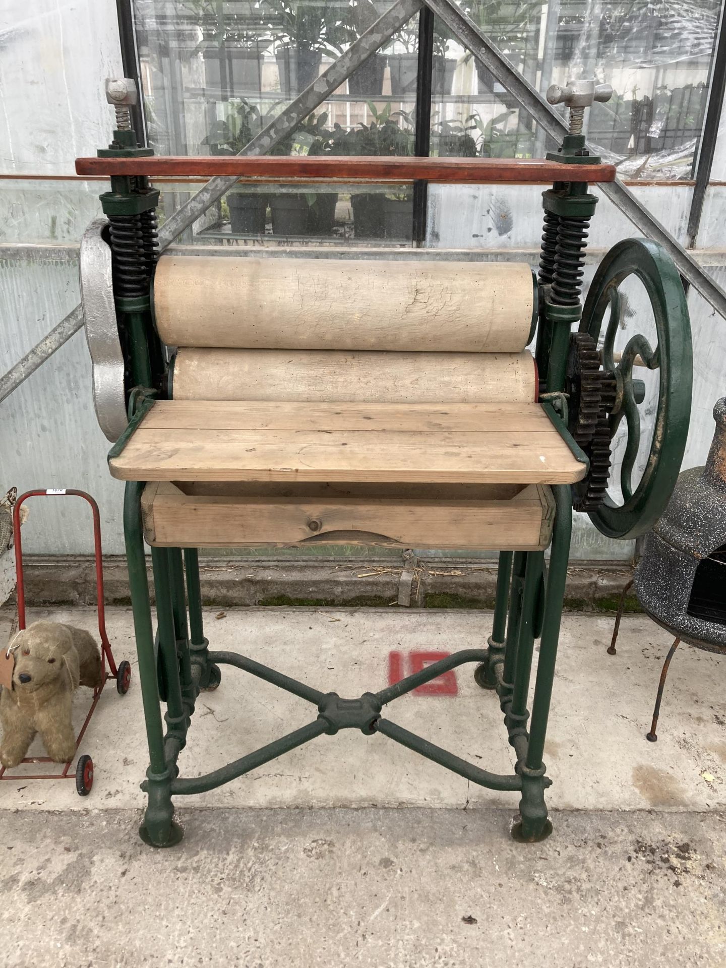 A VINTAGE CAST IRON AND WOODEN MANGLE