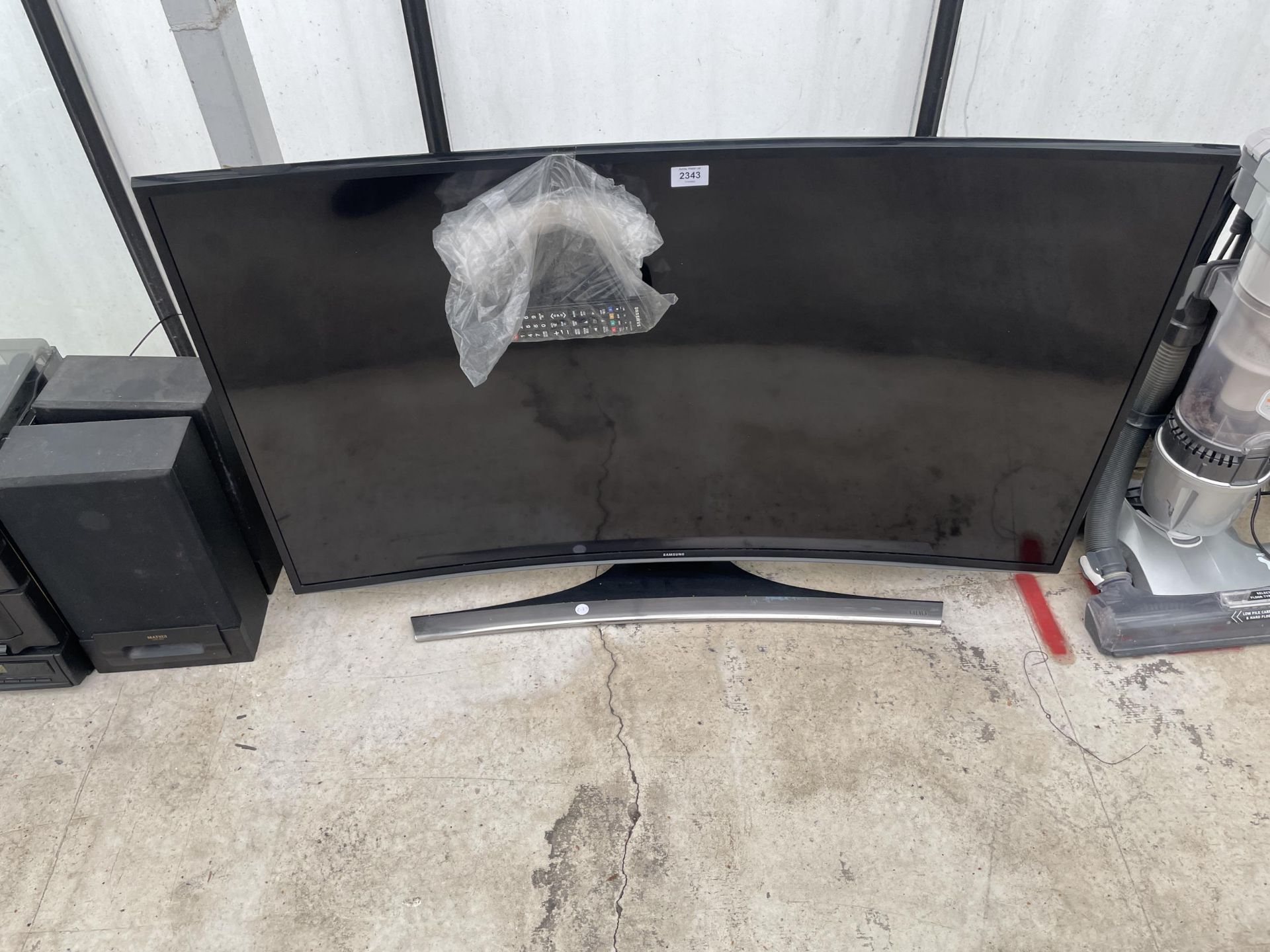 A SAMSUNG 48" CURVED TELEVISION WITH REMOTE CONTROL
