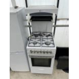 A WHITE FLAVEL DUAL FUEL OVEN AND HOB