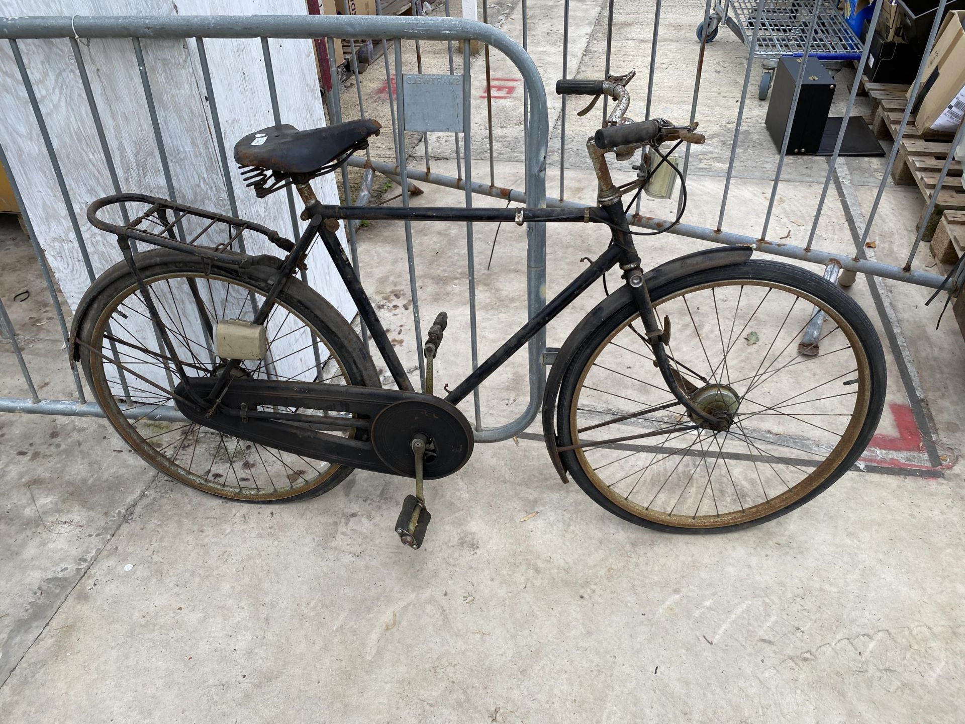 A VINTAGE GENTS BIKE WITH LEATHER SADDLE