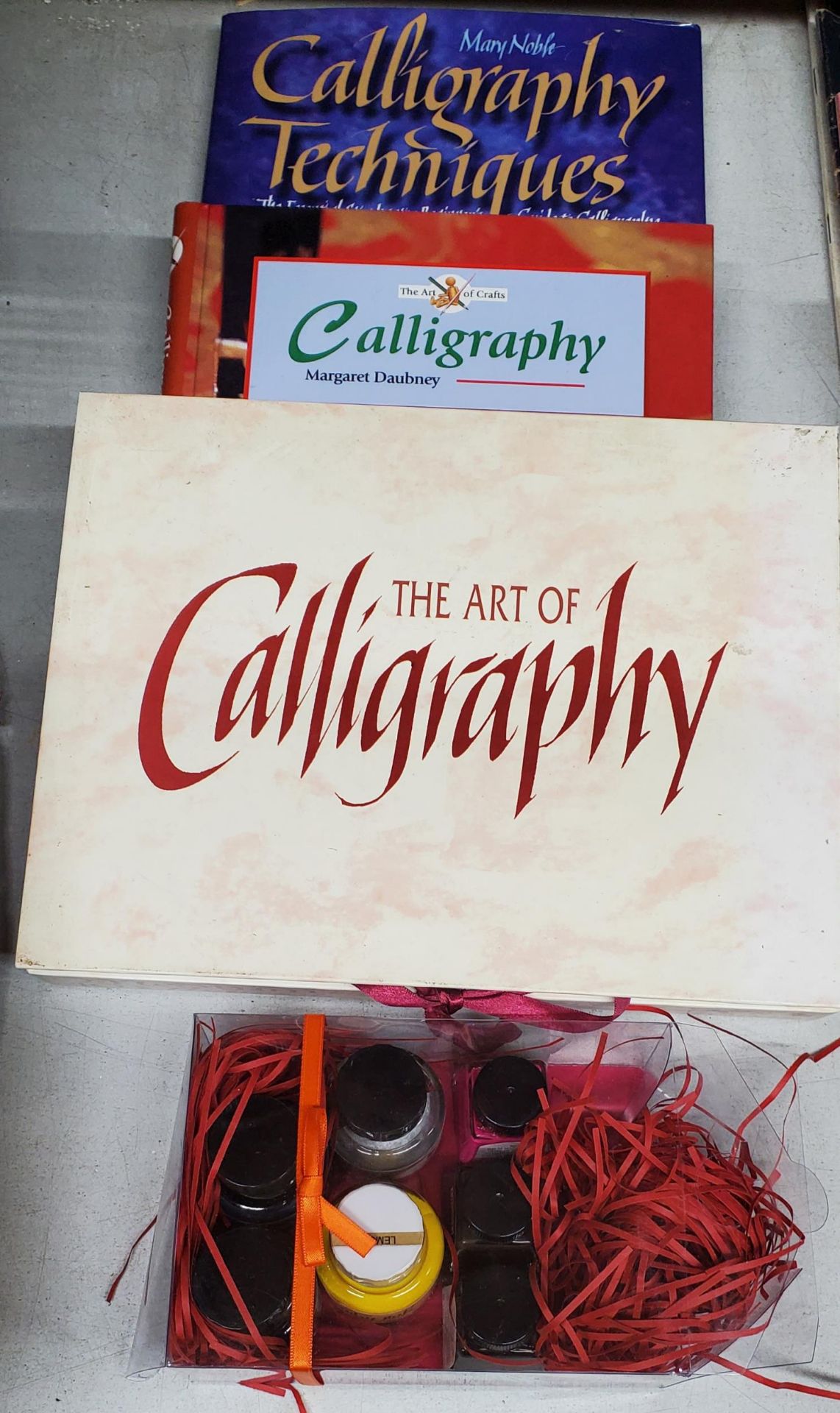 A GROUP OF CALLIGRAPHY BOOKS AND INK