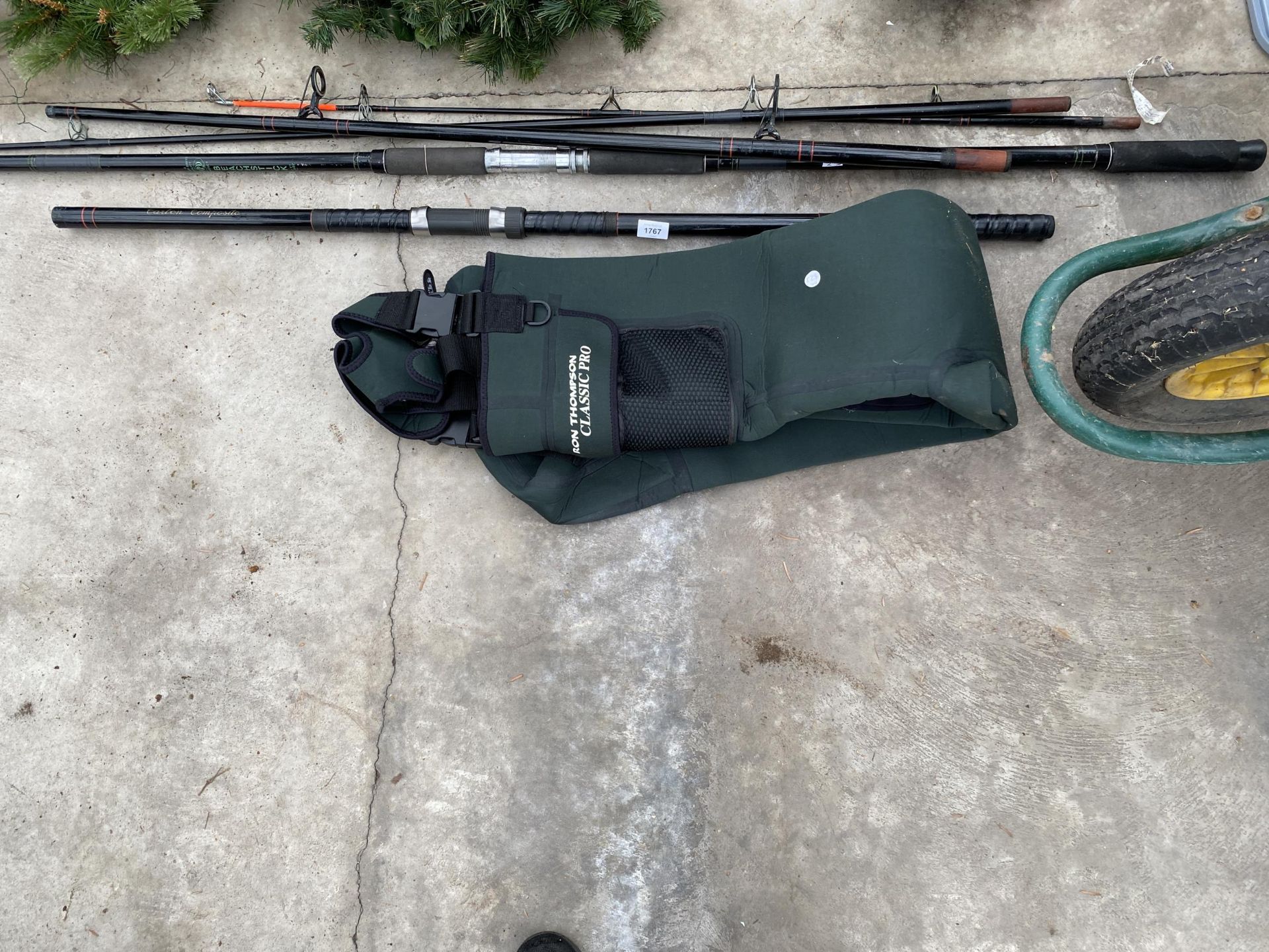 AN ASSORTMENT OF FISHING RODS AND A PAIR OF RON THOMPSON WADERS