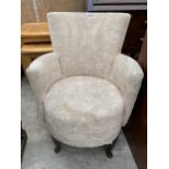 A MODERN BEDROOM CHAIR ON FRONT CABRIOLE LEGS