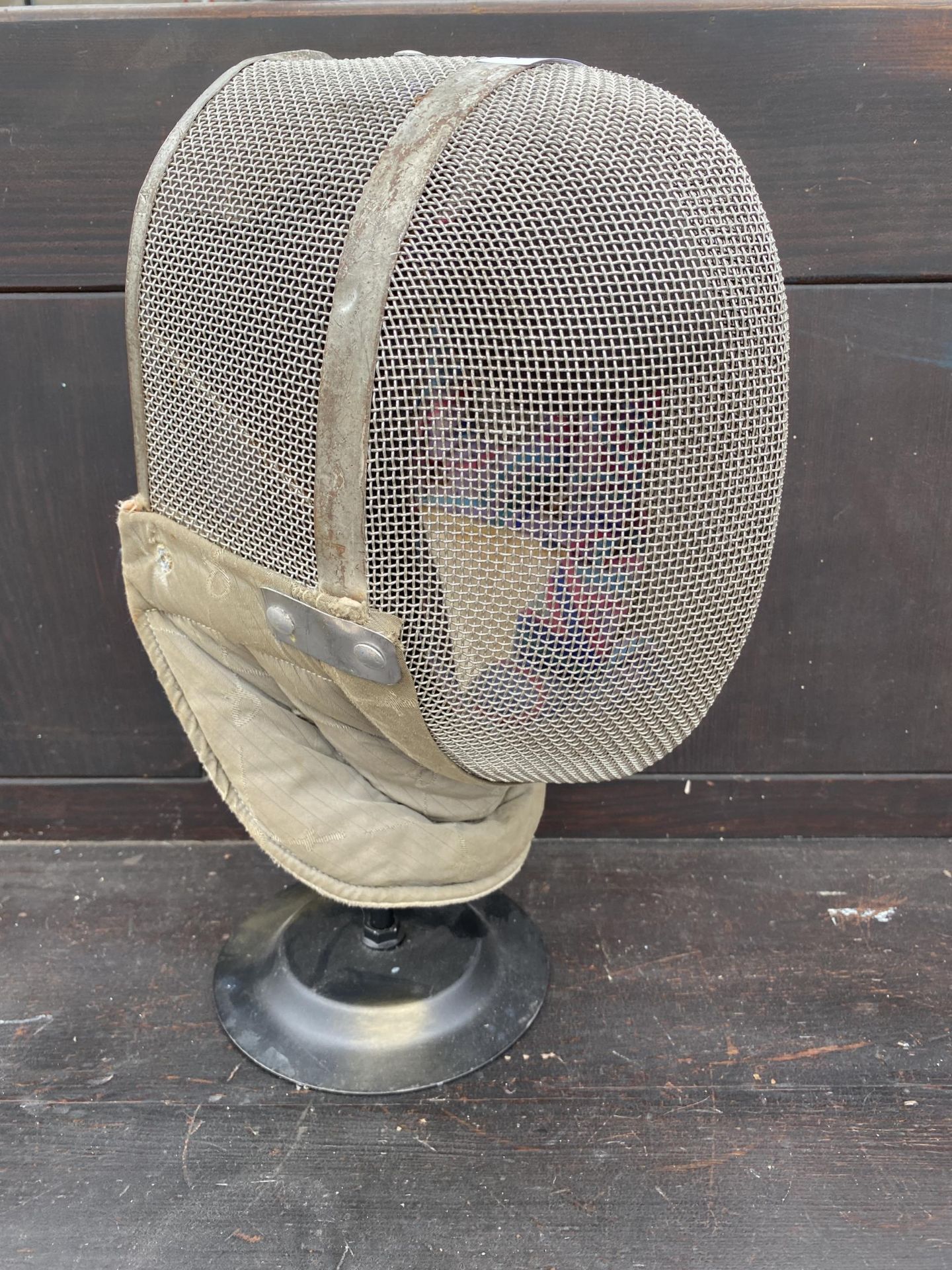 A VINTAGE FRANCE-LAMES FENCING FACE GUARD WITH STAND