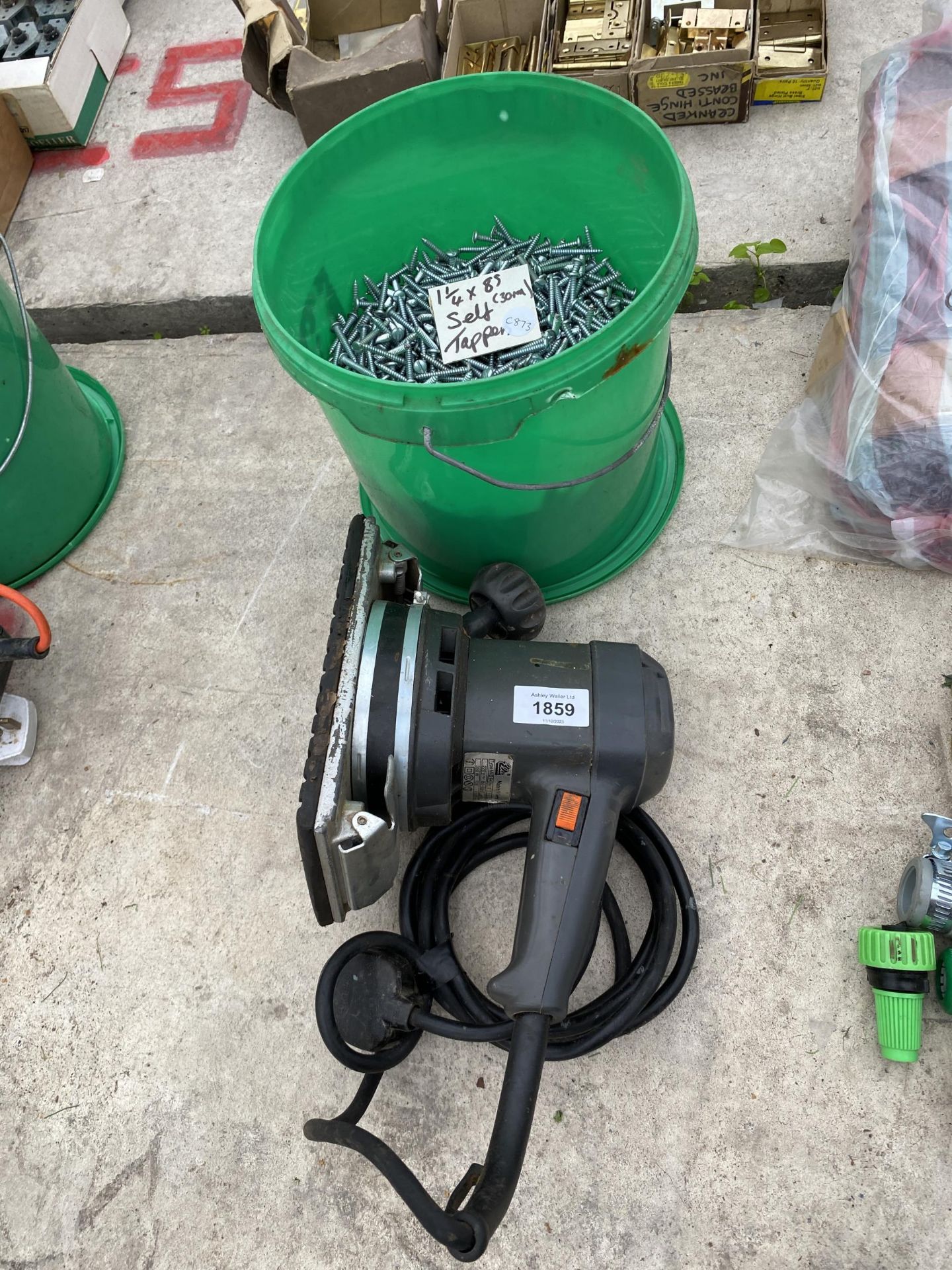 AN ELECTRIC SANDER AND A LARGE QUANTITY OF SELF TAPPING SCREWS
