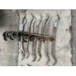 A COLLECTION OF STAINLESS STEEL ABITOIR HOOKS