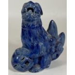 A CHINESE BLUE STONEWARE MODEL OF A FOO DOG, HEIGHT 15CM