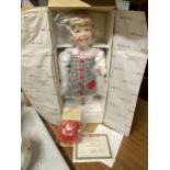 A BOXED MCMEMORIES PORCELAIN KATIE DOLL WITH CERTIFICATE