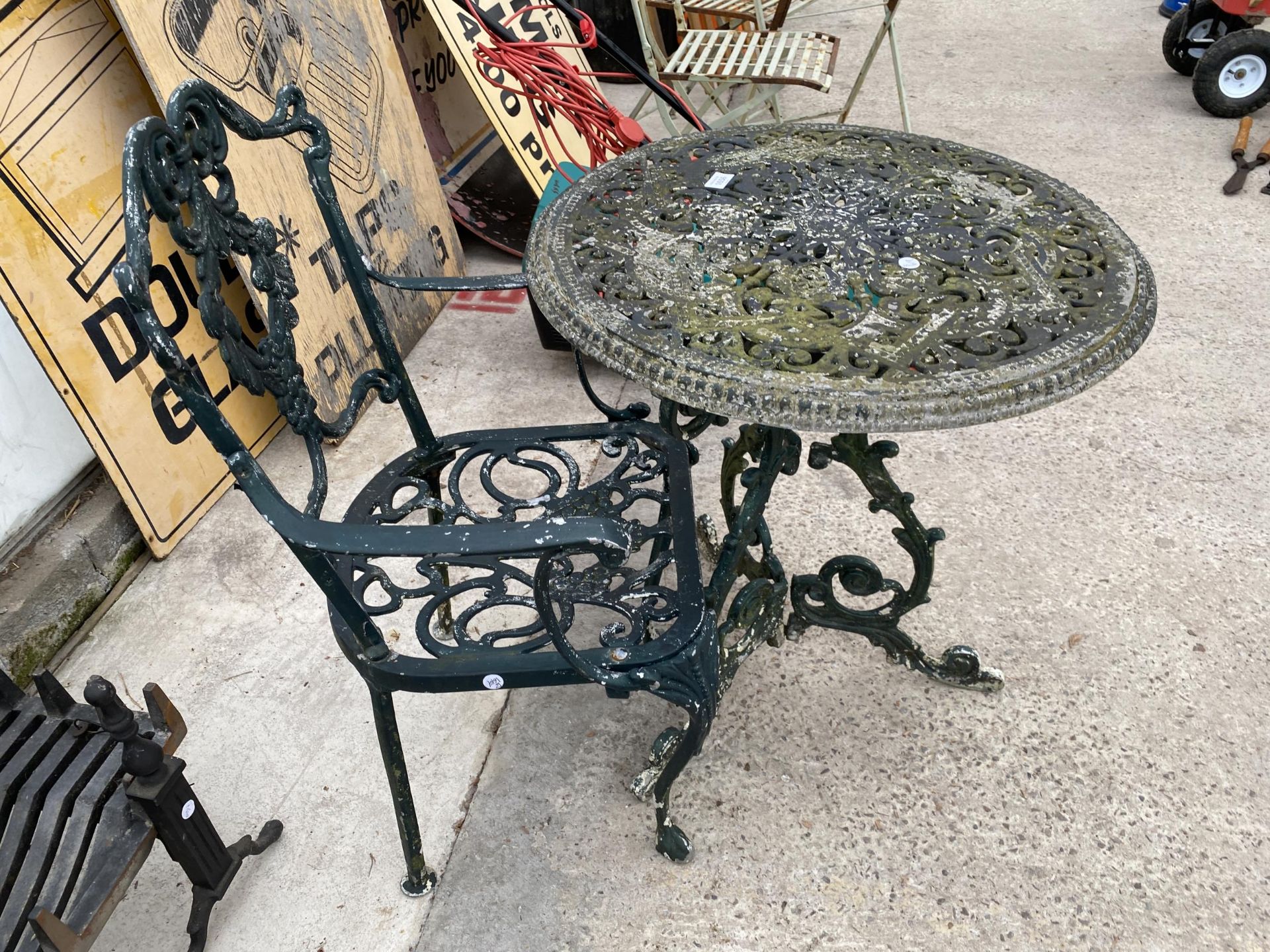 A DECORATIVE VINTAGE CAST IRON BISTRO TABLE AND A CAST ALLOY BISTRO CHAIR - Image 2 of 3
