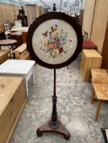 A VICTORIAN ROSEWOOD POLE SCREEN WITH SILK WORK EMBROIDERY DEPICTING FLOWERS